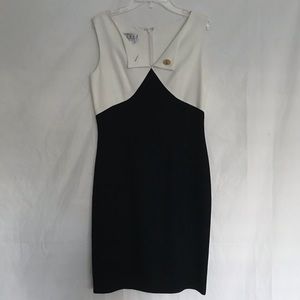 Black and white dress with gold button accessory
